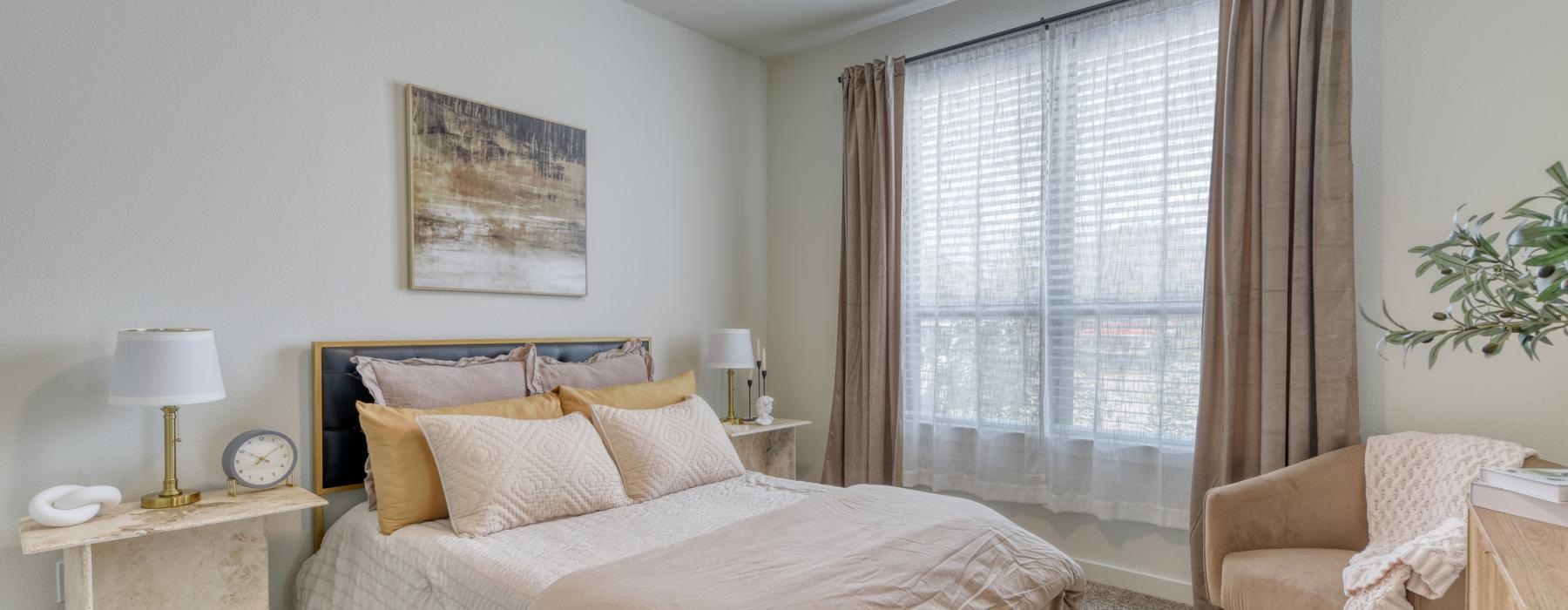 a bedroom with a large window