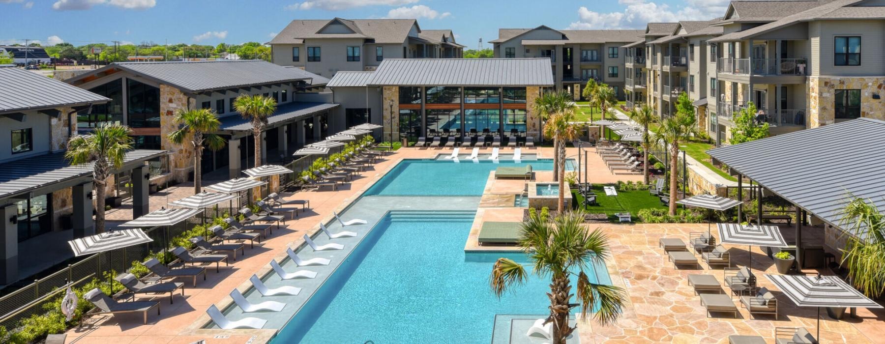 a pool surrounded by buildings