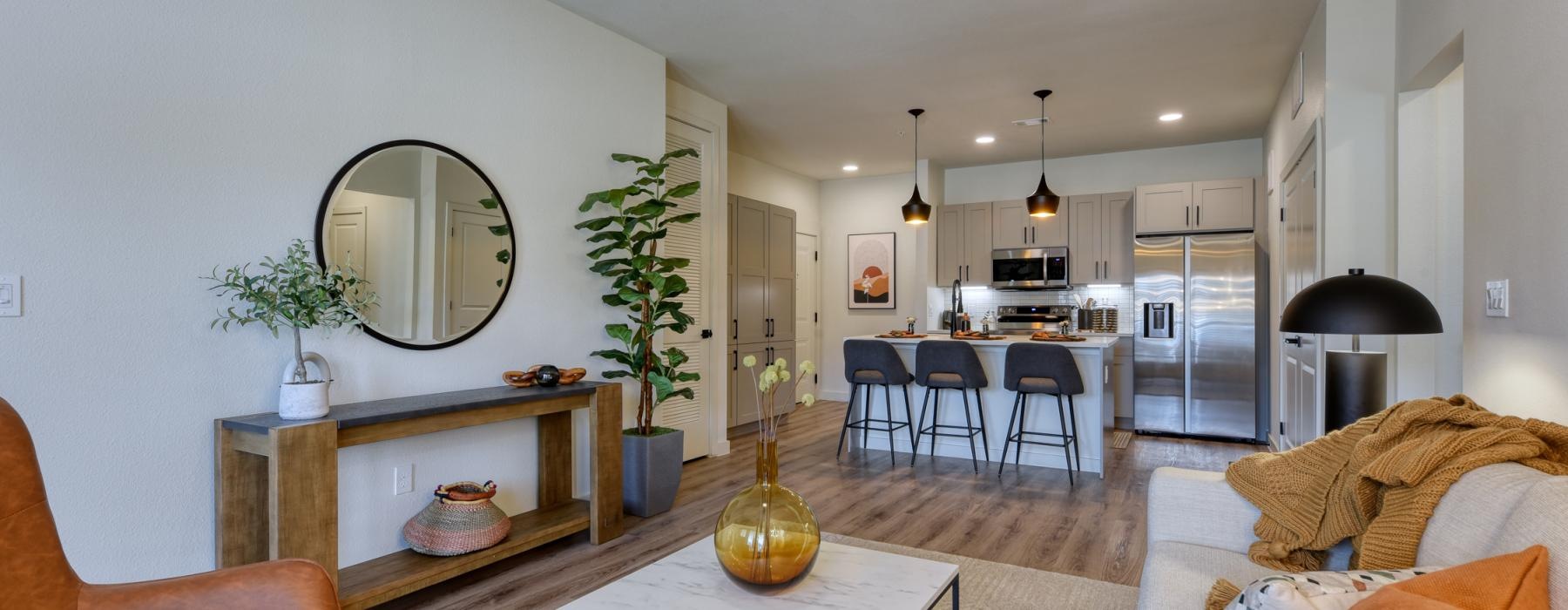 a living room with a dining table and couches