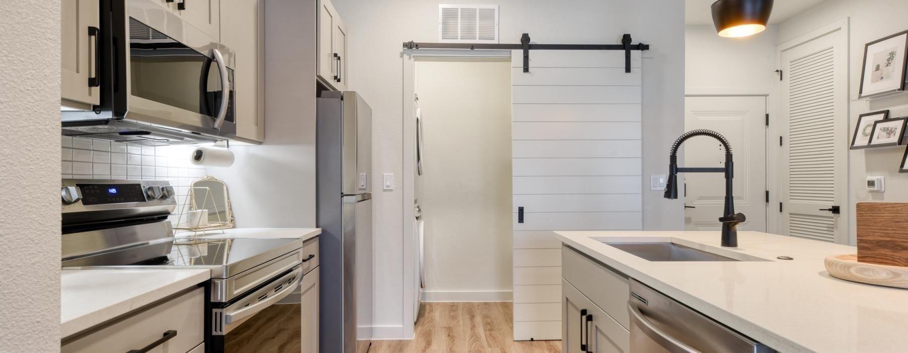 a kitchen with white cabinets